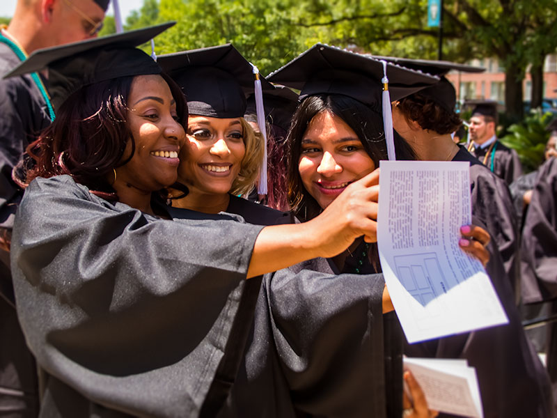 Tulane SoPA graduates celebrating with a selfie