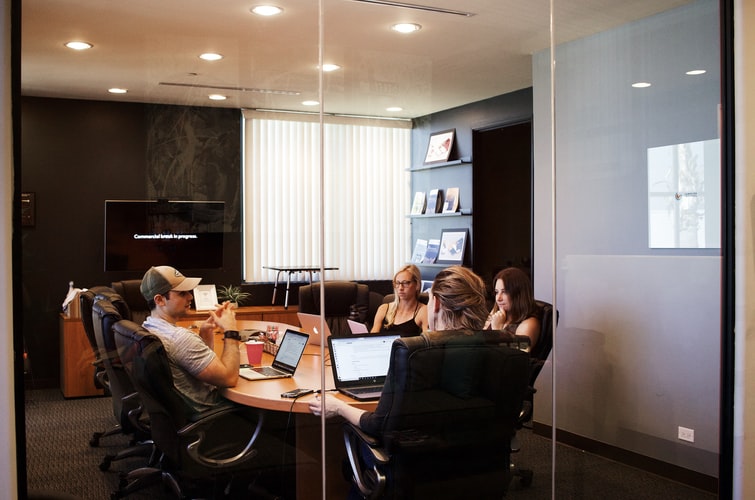 A group of people working in a conference room
