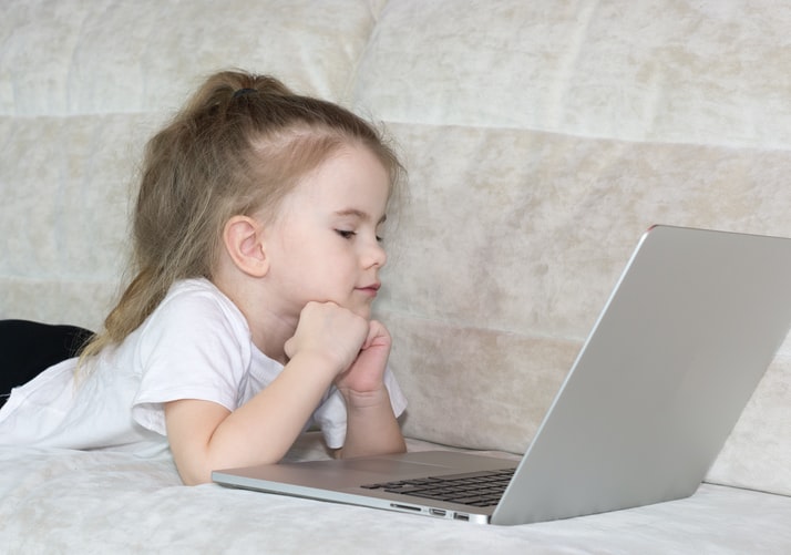 A child looking at a laptop