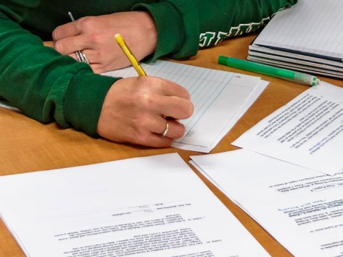 Closeup of Tulane SoPA student's hands working at a desk