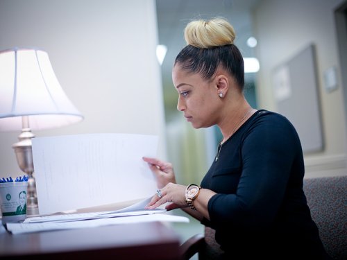 Tulane SoPA student studying by a lamp