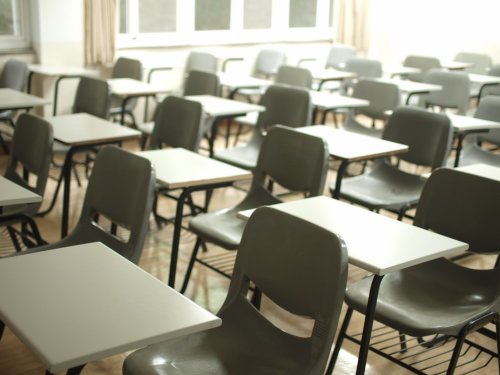 Classroom full of desks for students learning english abroad - Tulane School of Professional Advancement