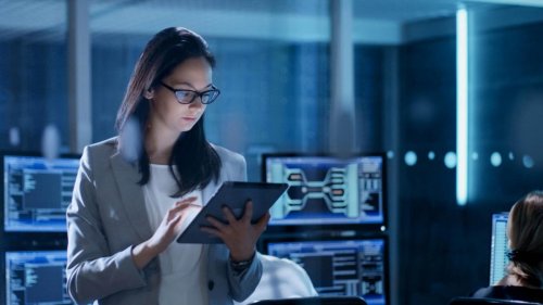 Learn about cloud security A woman in tech working on a tablet