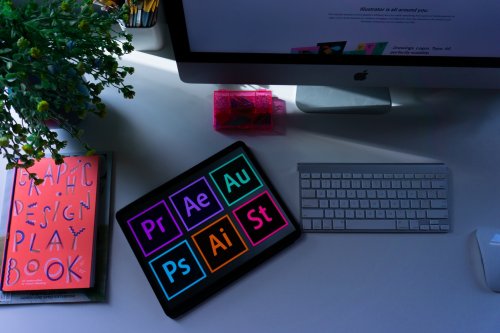 Graphic Design work station with notebook, tablet, and computer - Tulane School of Professional Advancement