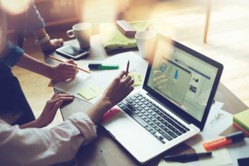 People planning finances at a laptop - Tulane School of Professional Advancement how-to-use-work-and-life-credits-to-save-money-when-going-back-to-school-laptop-image.jpg