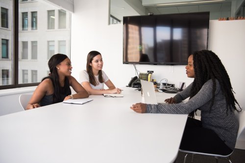 Read about the benefits of SHRM membership A group of people during a meeting in a conference room