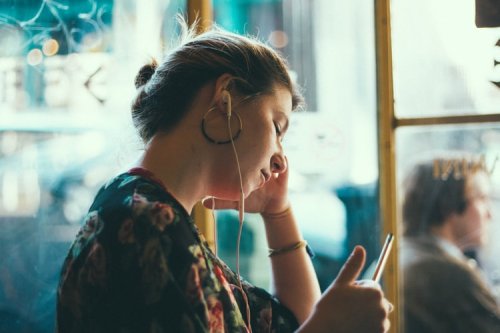 Student enjoying her favorite podcast Student enjoying her favorite podcast