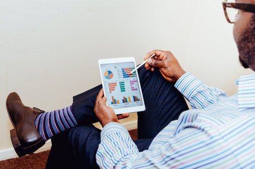 Pursue a career in accounting A person looking at charts on a tablet