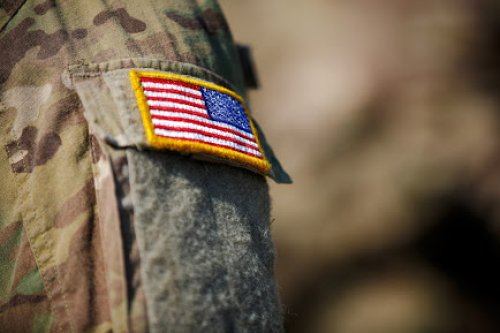 In the Military? You May Be Eligible for College Credit Through DSST A military uniform with an American flag patch