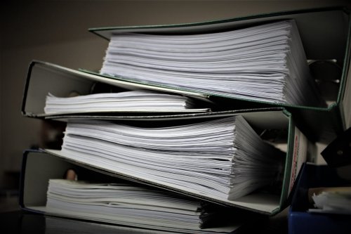 Stack of binders - Tulane School of Professional Advancement