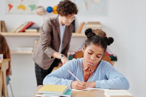 Gain the skills to become a top educator Students working in a classroom