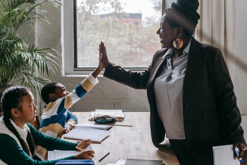 Learn more about Teacher Certifications vs. Teaching Endorsements A teacher giving students a high five