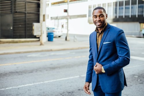 Get a Masters of Public Administration A man walking down a street in a business suit
