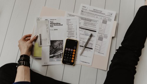 Maintain your financial responsibilities A person with a folder of financial documents