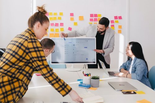 Read about public affairs vs public relations Work professionals in a meeting