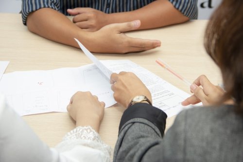 Follow this guide if you're thinking of making a career change People during an interview going over a resume