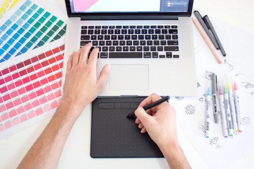 Learn about interior design and technology A designer using a drawing tablet