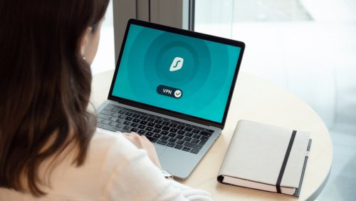 COVID-19's Impact on Cybersecurity for Remote Employees A person on a laptop using a VPN