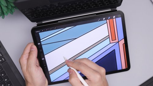 Make a stunning digital design portfolio A person designing on a tablet