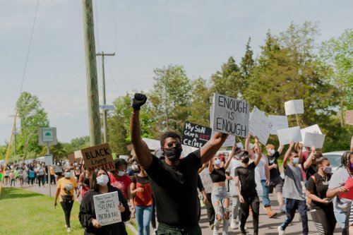 Learn about these community leaders of color A group of people protesting