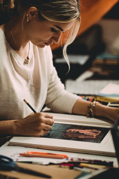 A girl working on a piece of art