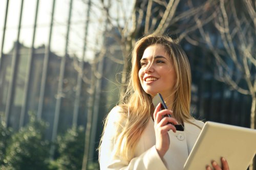 A young professional talking into a phone