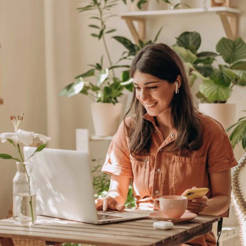 smiling woman using a computer