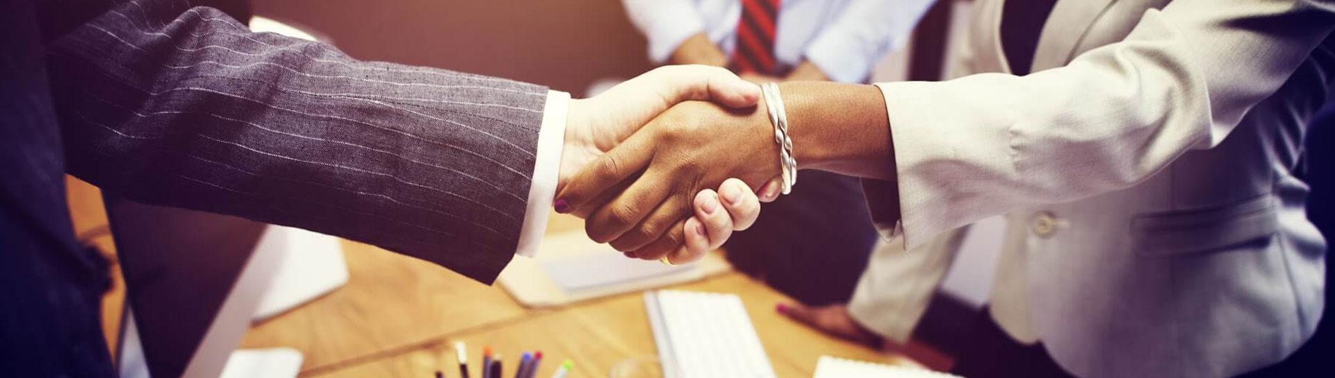 College Graduate Shaking Hands with Employer