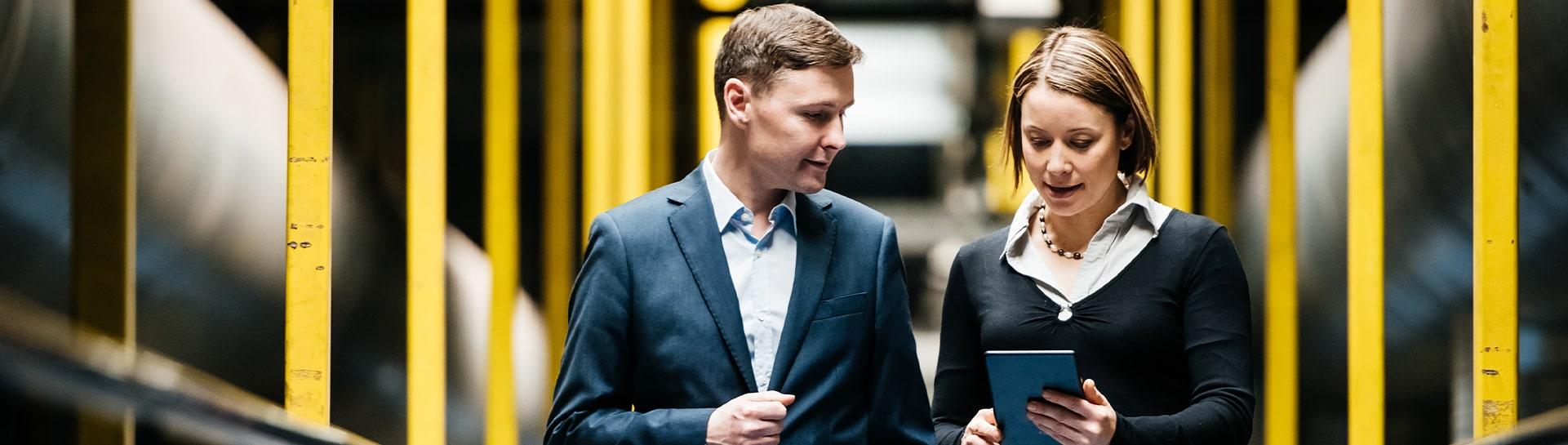 Two business people looking at a tablet