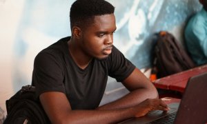 A student working on a laptop