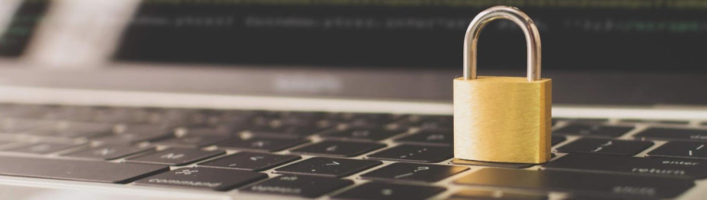 A padlock sitting on a laptop keyboard