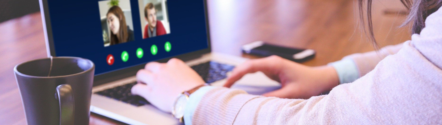 A person on a video call on their laptop