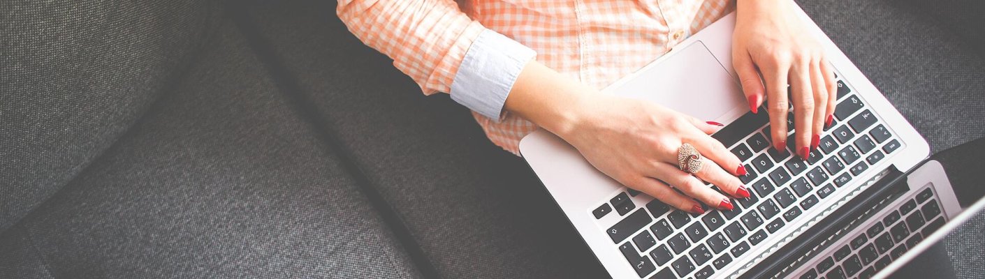 A person typing on a laptop