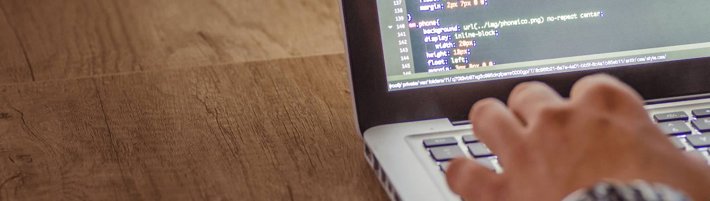 A person writing code on a computer