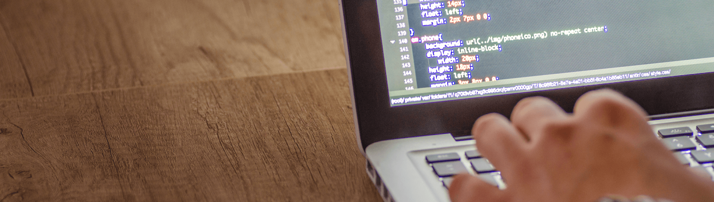 A person writing code on a computer
