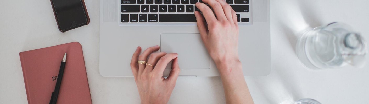 A person typing on a laptop