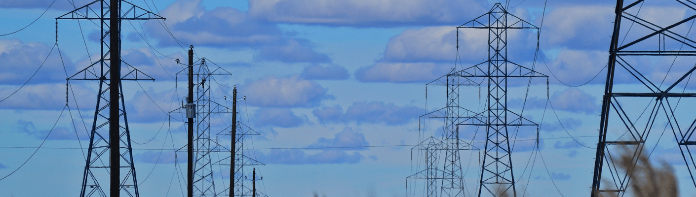 Rows of power lines under a blue sky - Tulane School of Professional Advancement