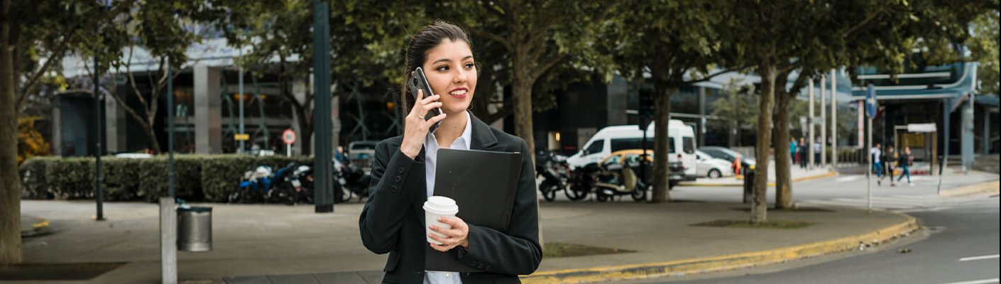 A City Manager walking and talking on the phone