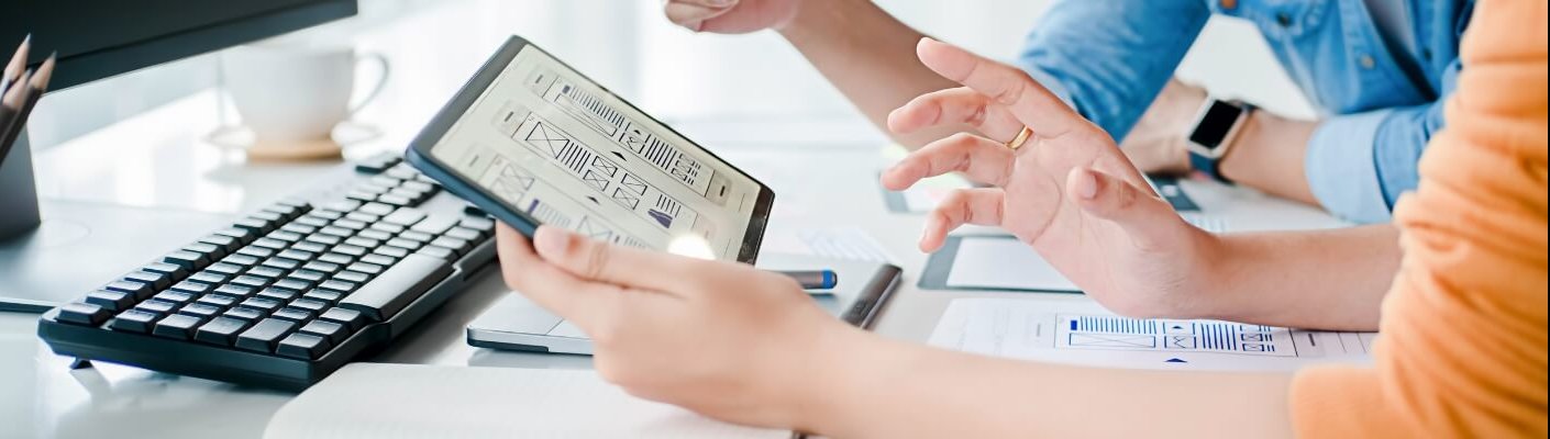 A person performing UX design on a tablet