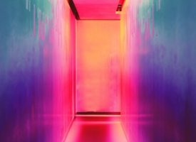 A colorfully-lit hallway