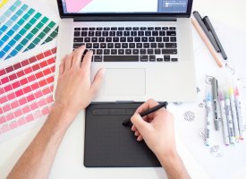 A designer using a drawing tablet