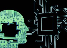 Graphic of a human head outline filled with circuitry connecting to a large computer chip.