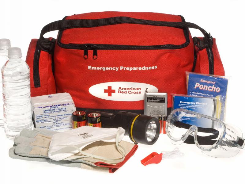 Red cross bag with emergency supplies for hurricane preparation