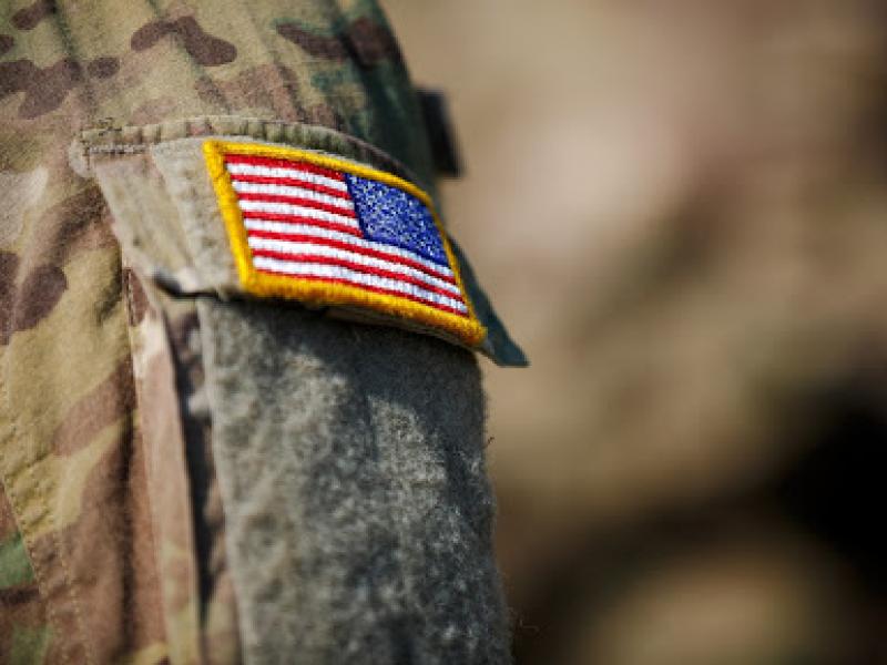 A military uniform with an American flag patch