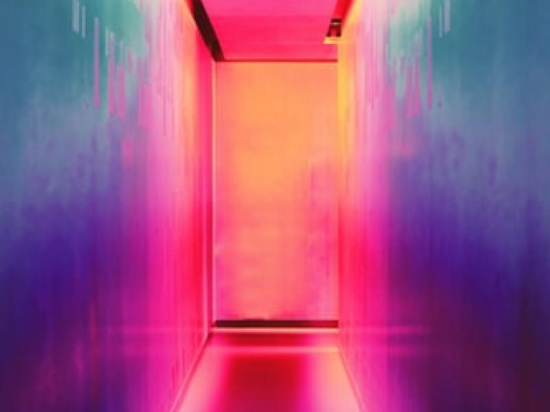 A colorfully-lit hallway