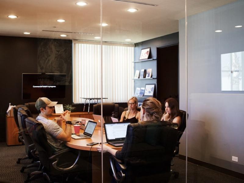A group of people working in a conference room