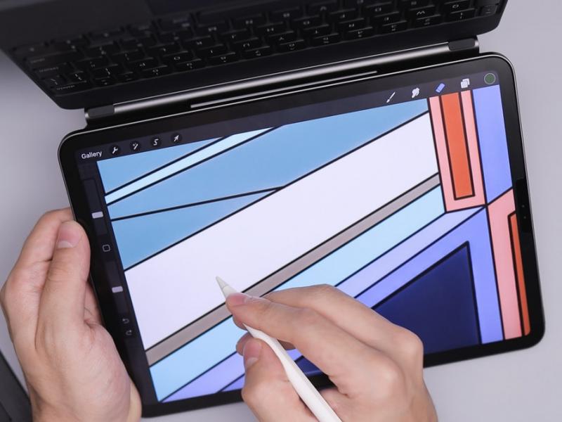 A person designing on a tablet